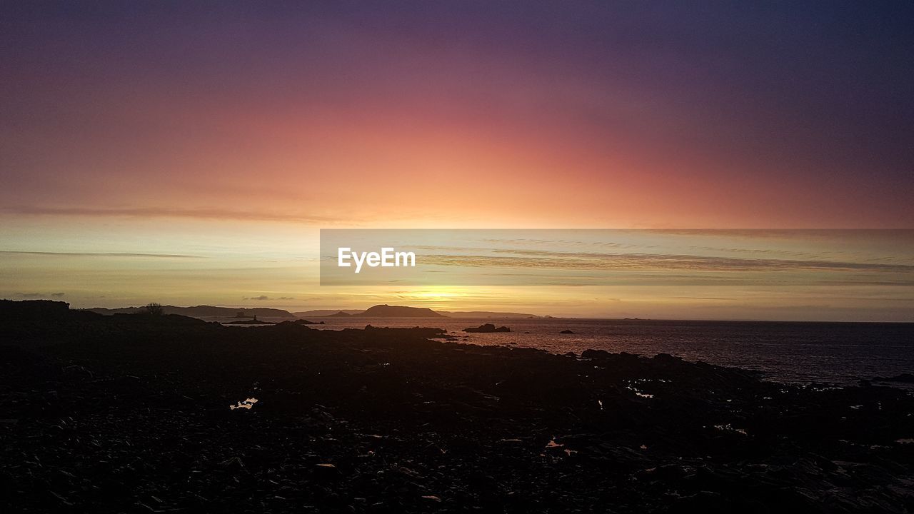 VIEW OF BEACH AT SUNSET