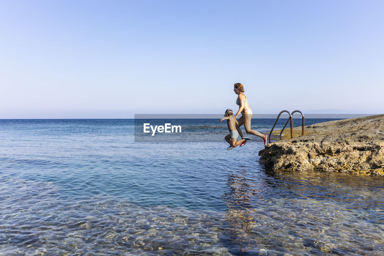 Full length of man against sea against clear sky