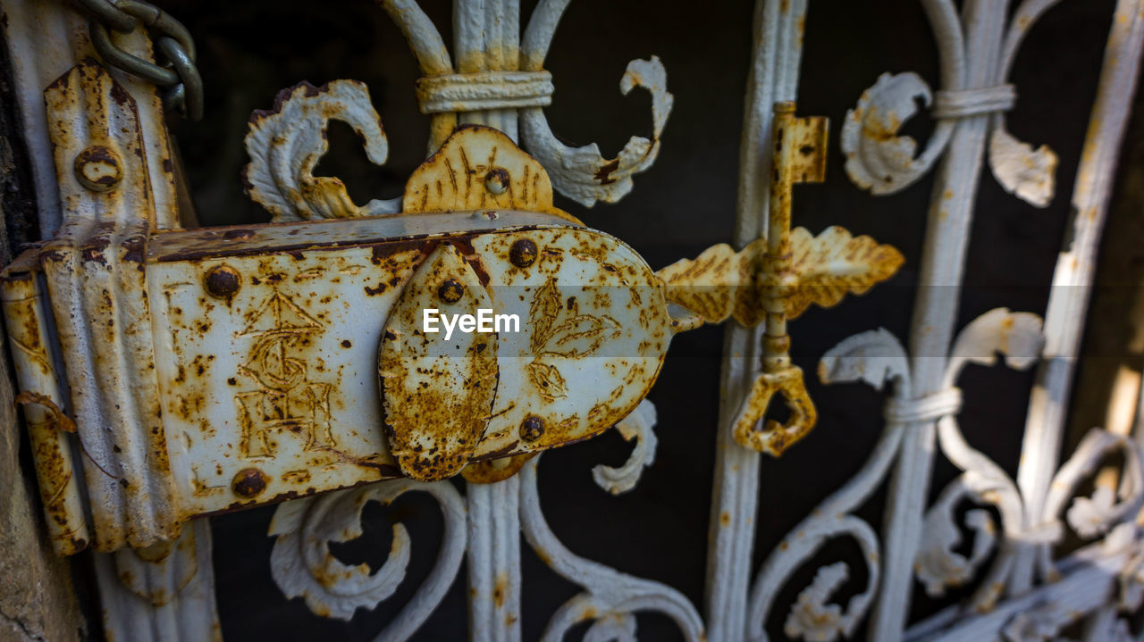 Close-up of old rusty metal fence