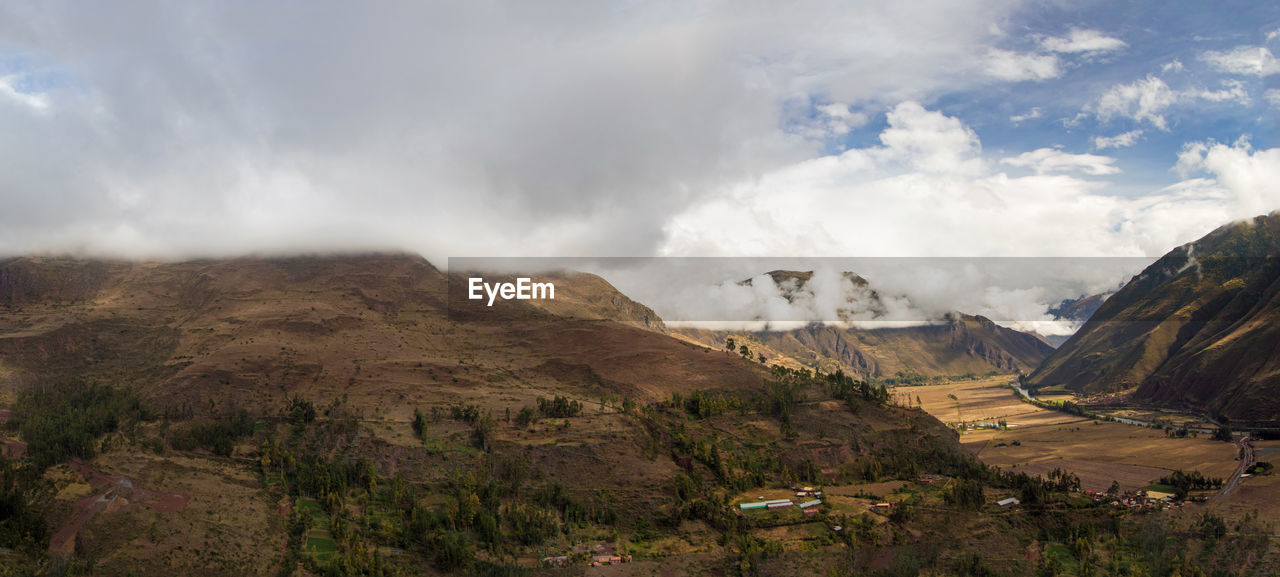 SCENIC VIEW OF VALLEY AGAINST SKY