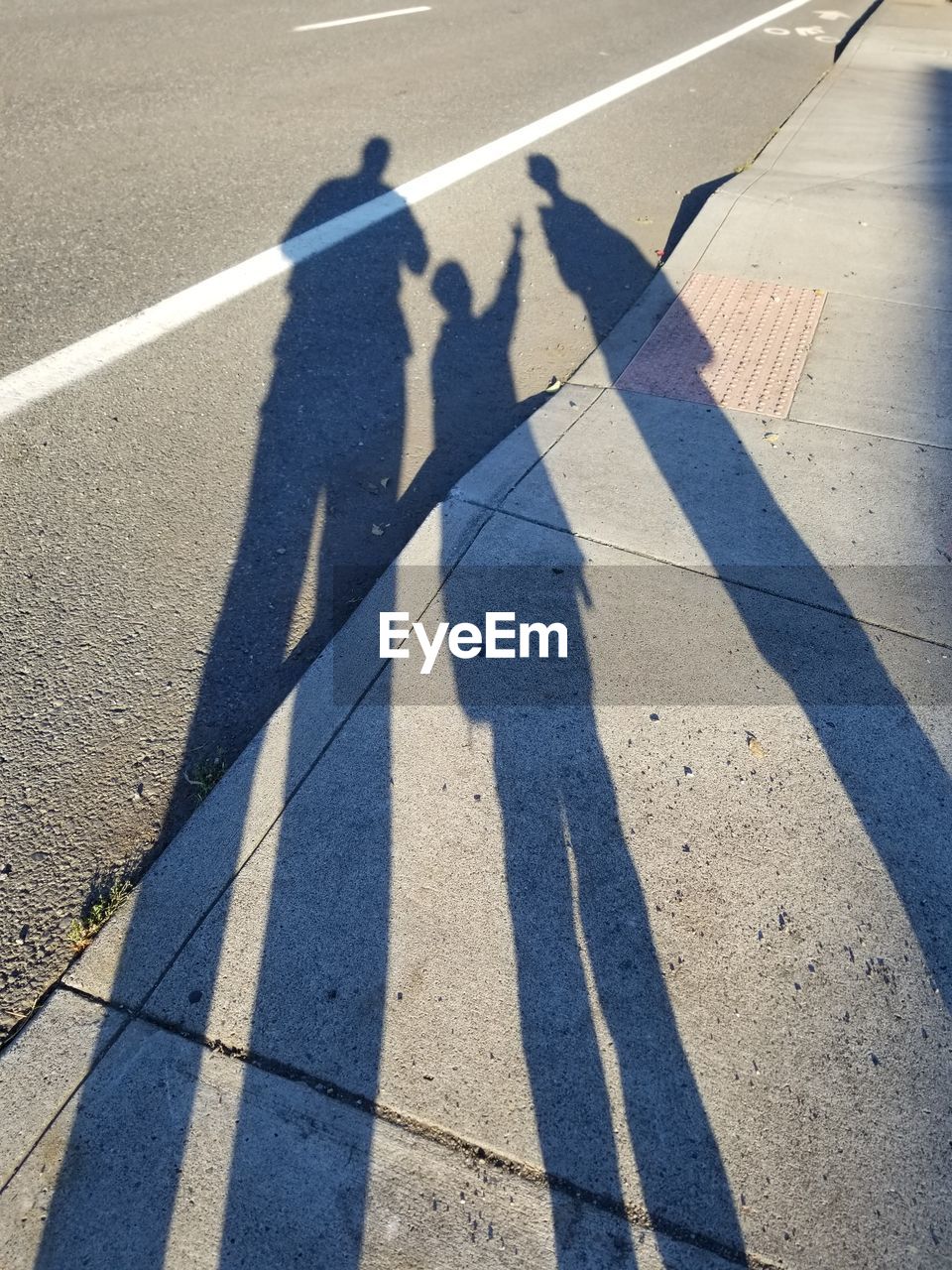 High angle view of shadows on street in city