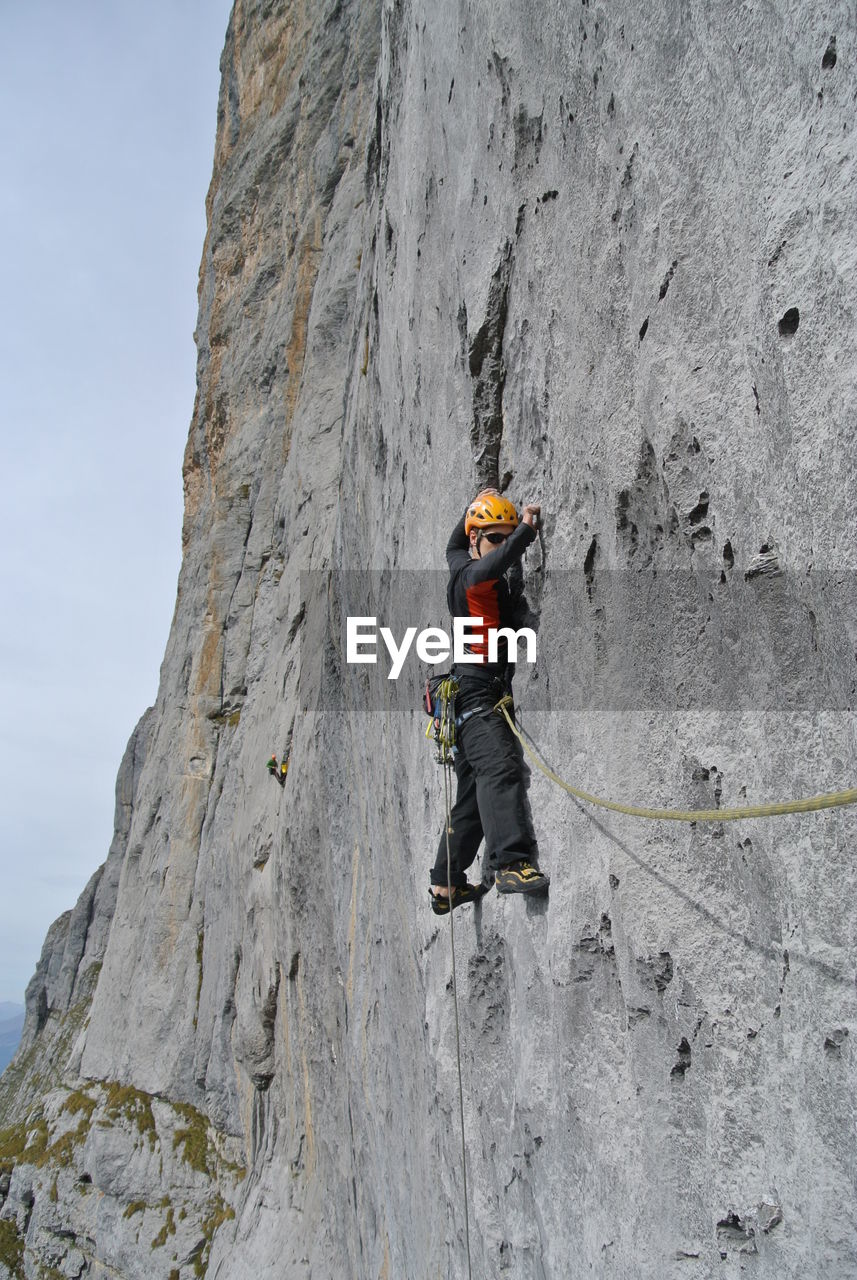 FULL LENGTH OF WOMAN STANDING ON ROCKS