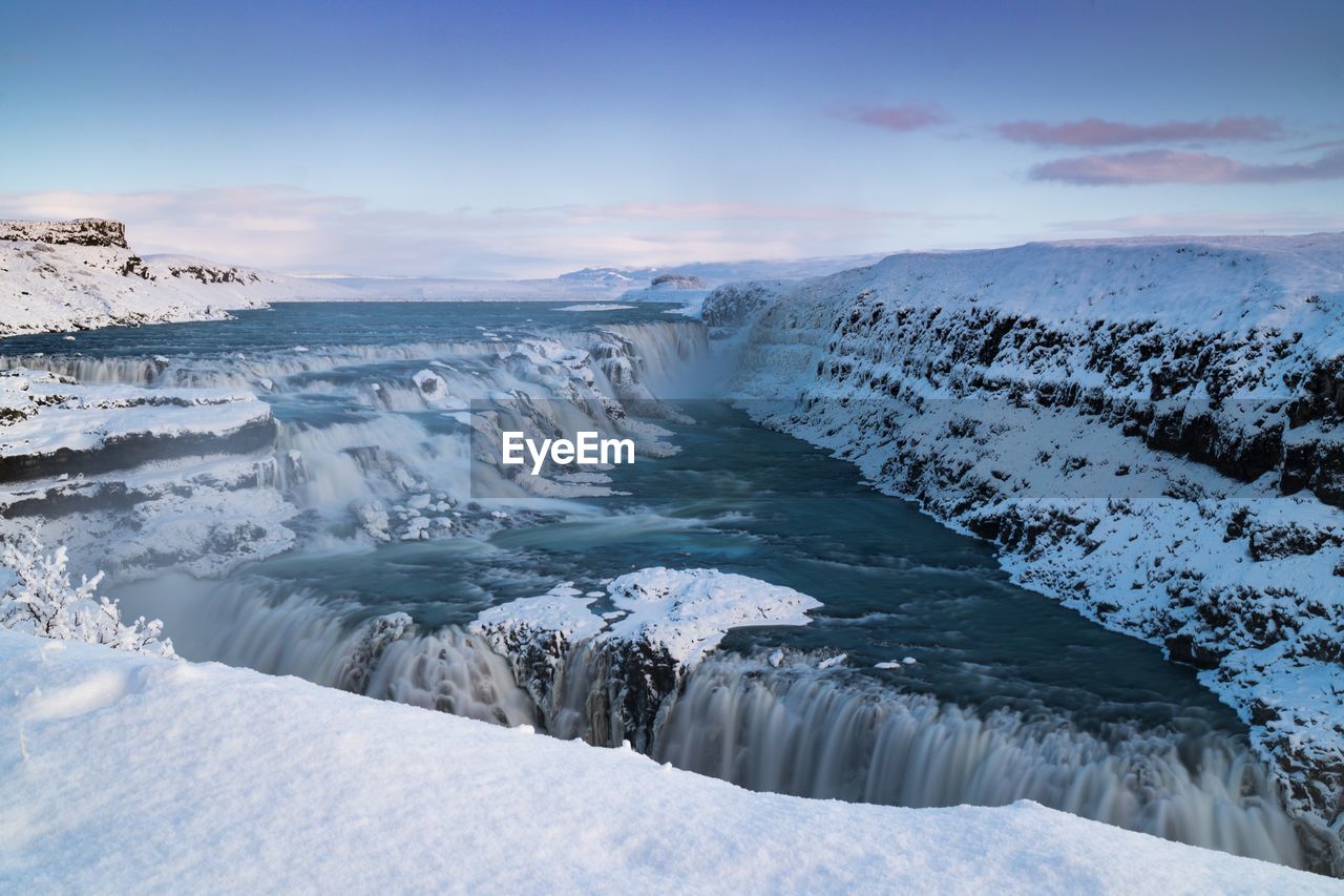 Scenic view of sea against sky during winter