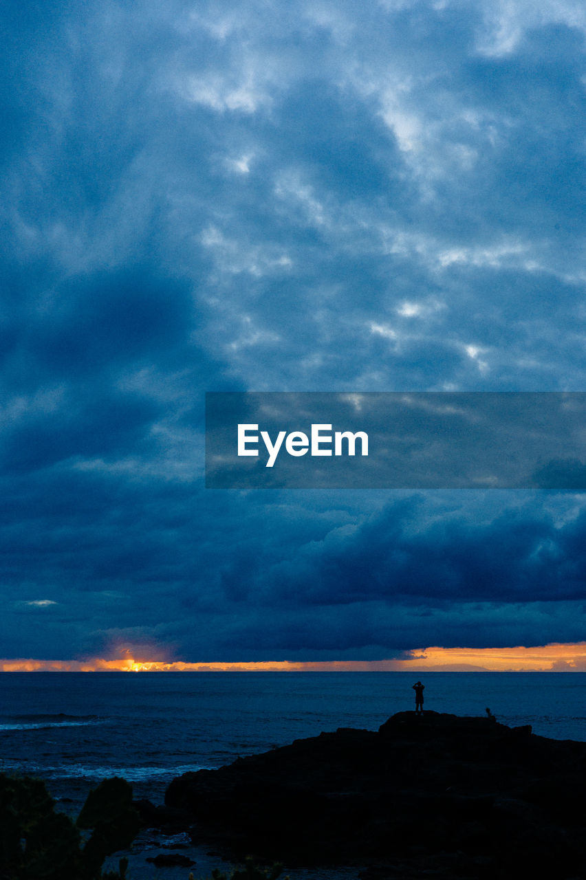 SILHOUETTE OF BEACH DURING SUNSET