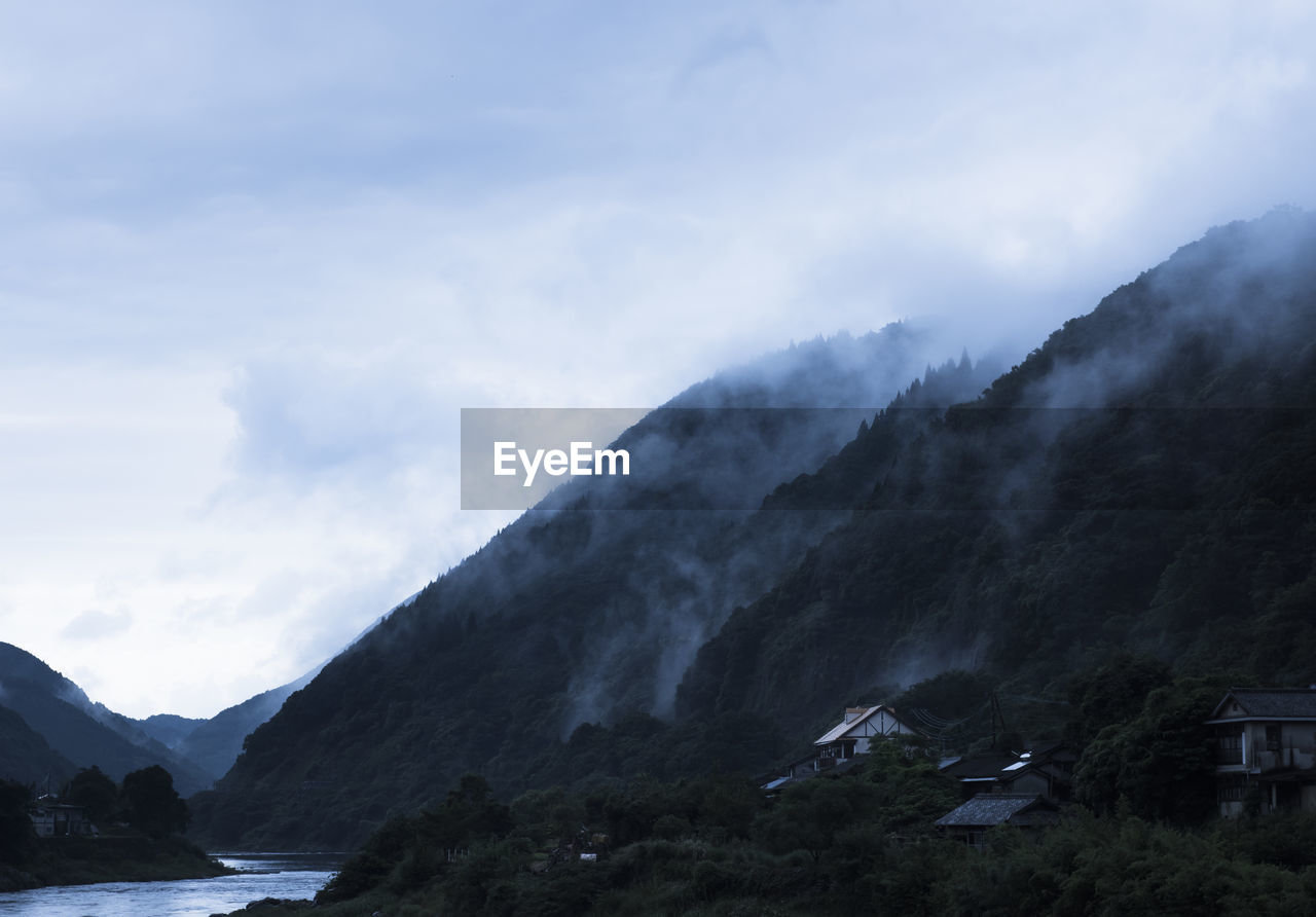 Scenic view of mountains against sky during winter