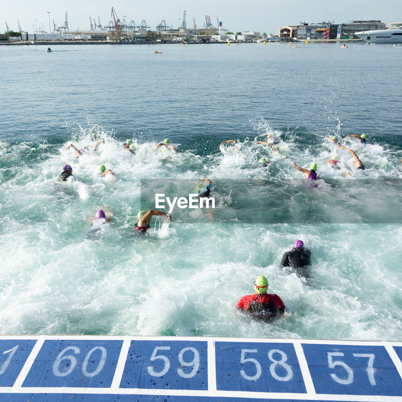 High angle view of people swimming in sea