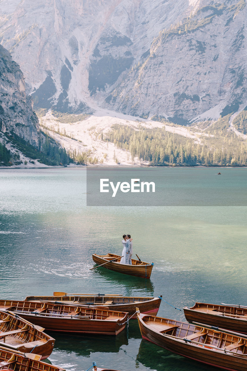 SCENIC VIEW OF LAKE AGAINST MOUNTAIN