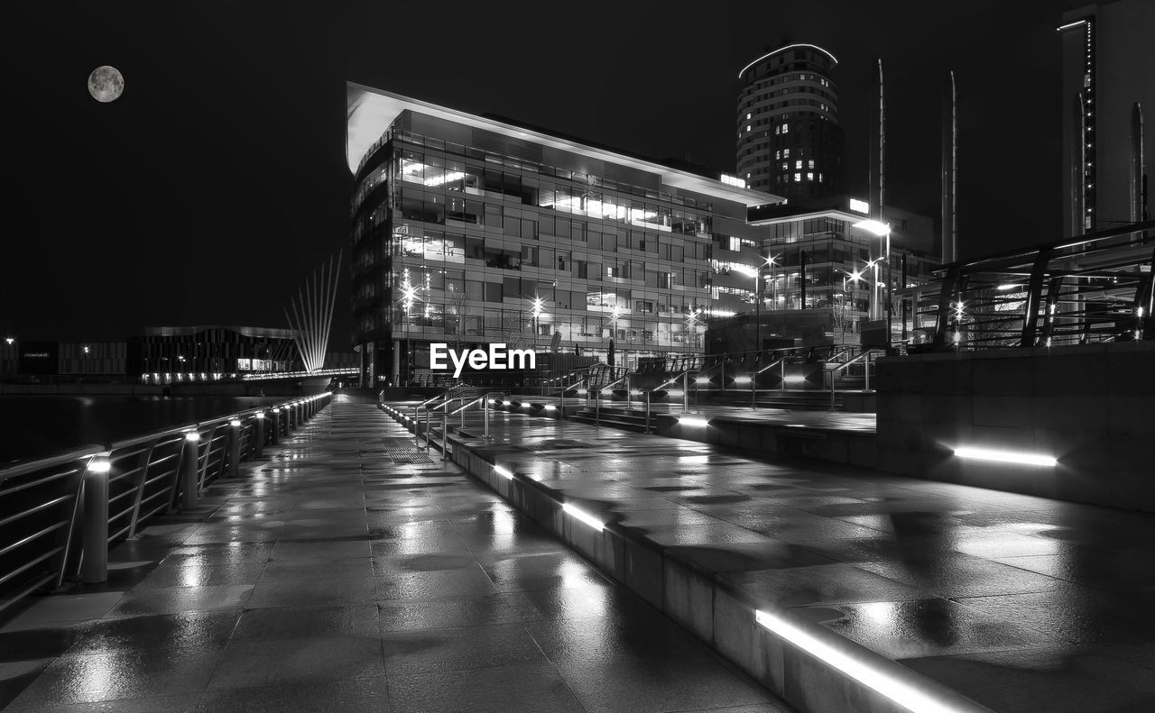 Illuminated building in city at night