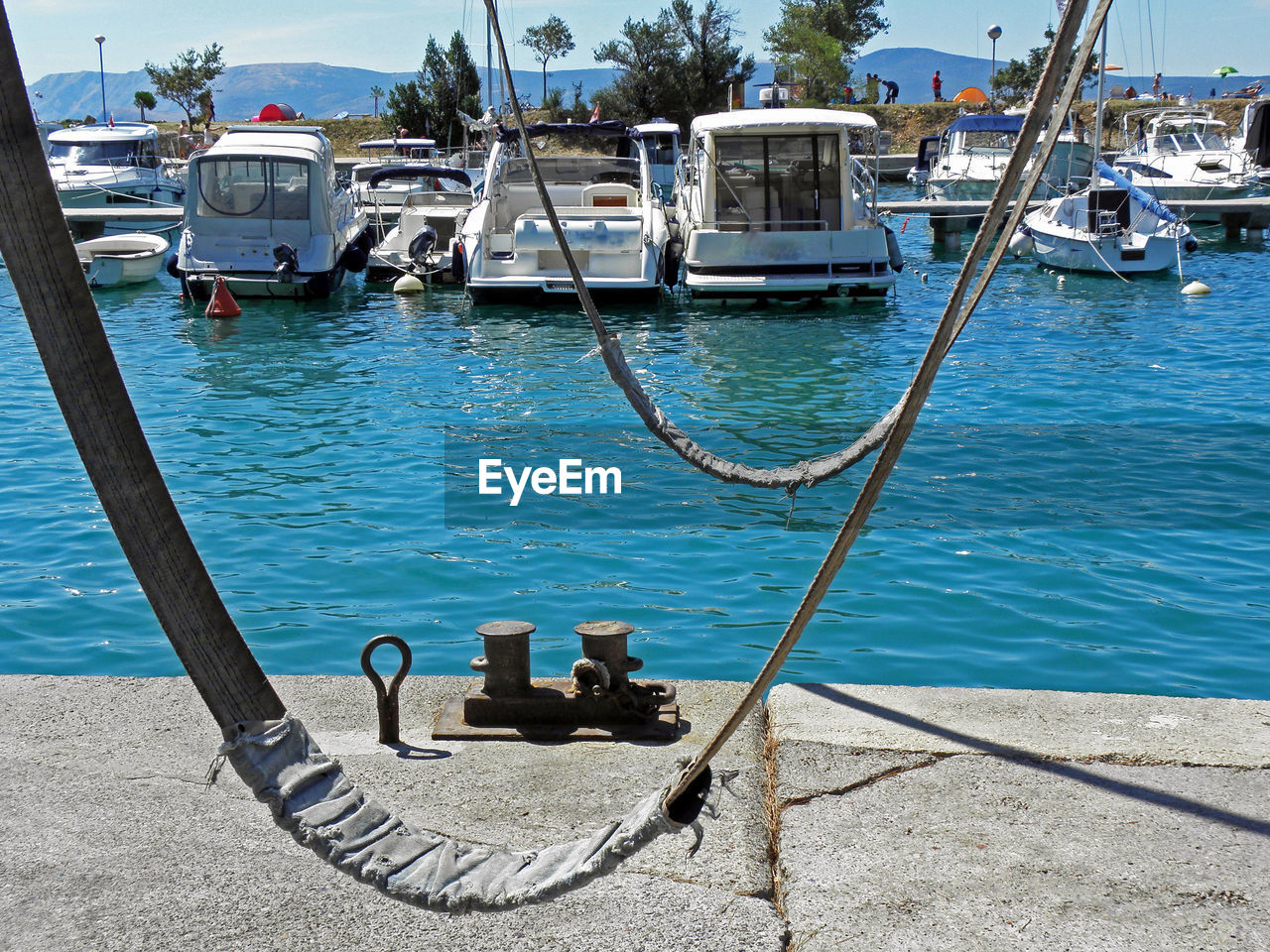 Boats moored at harbor