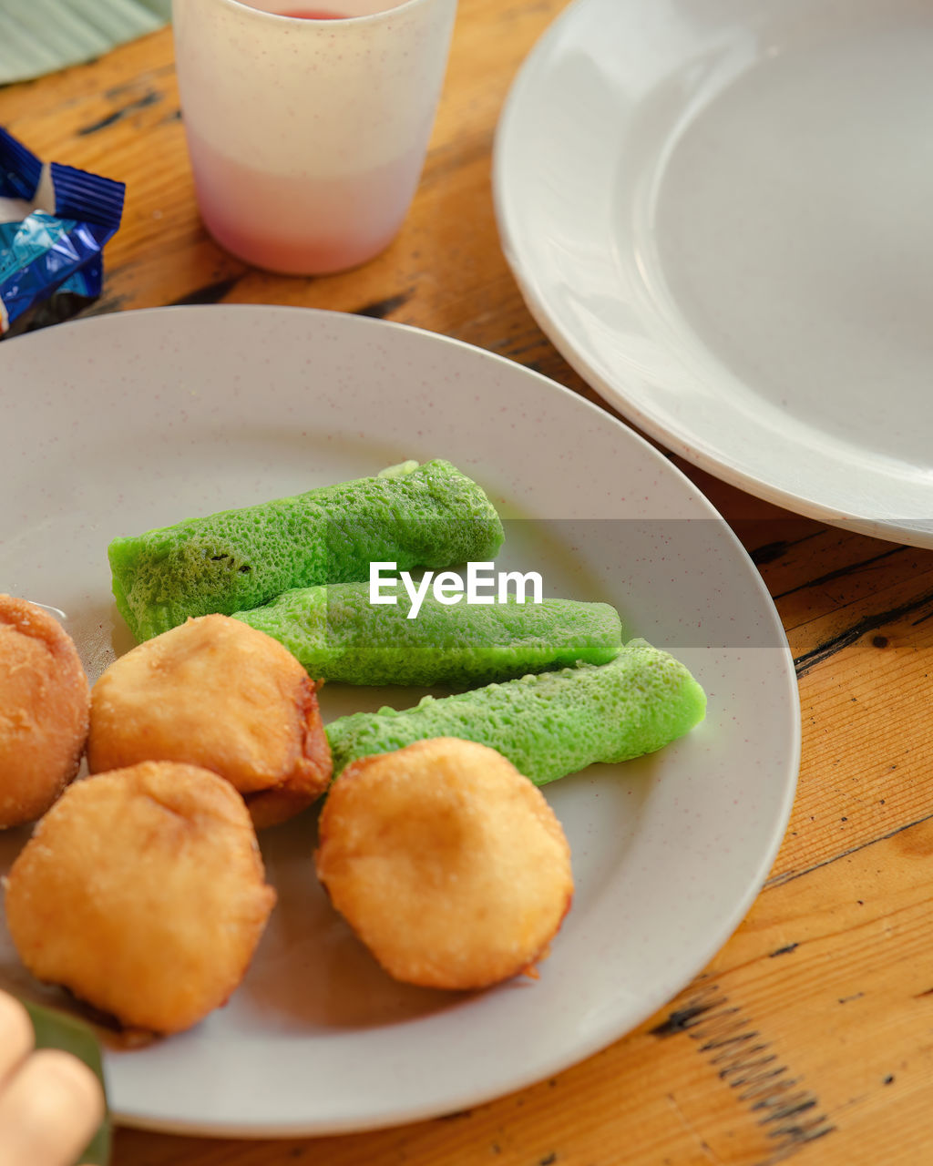 Malaysia sweet dessert with coconut known as kuih ketayap and burger mini.