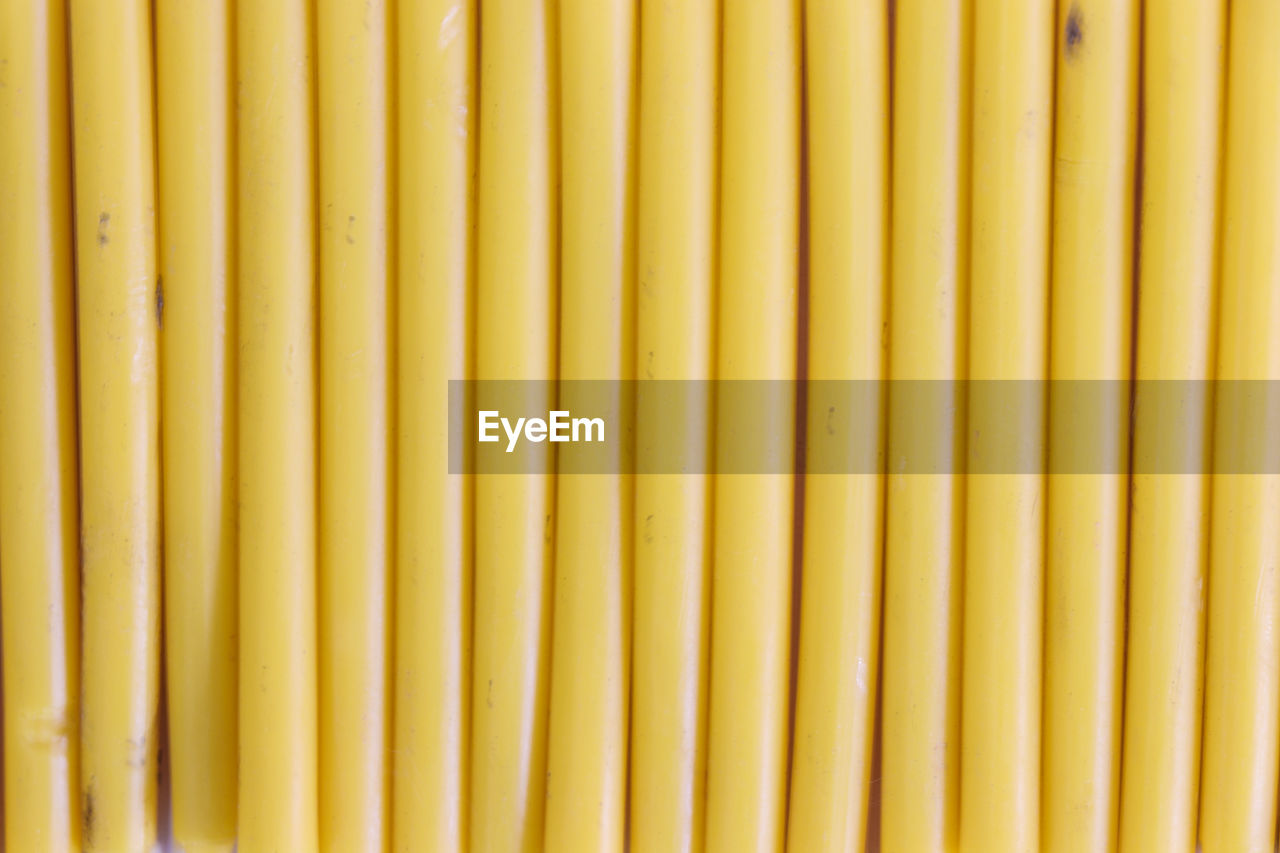 FULL FRAME SHOT OF YELLOW AND KNIFE ON TABLE