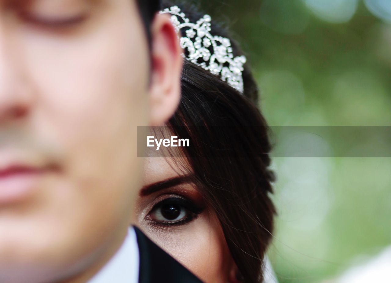 Cropped image of bride with groom