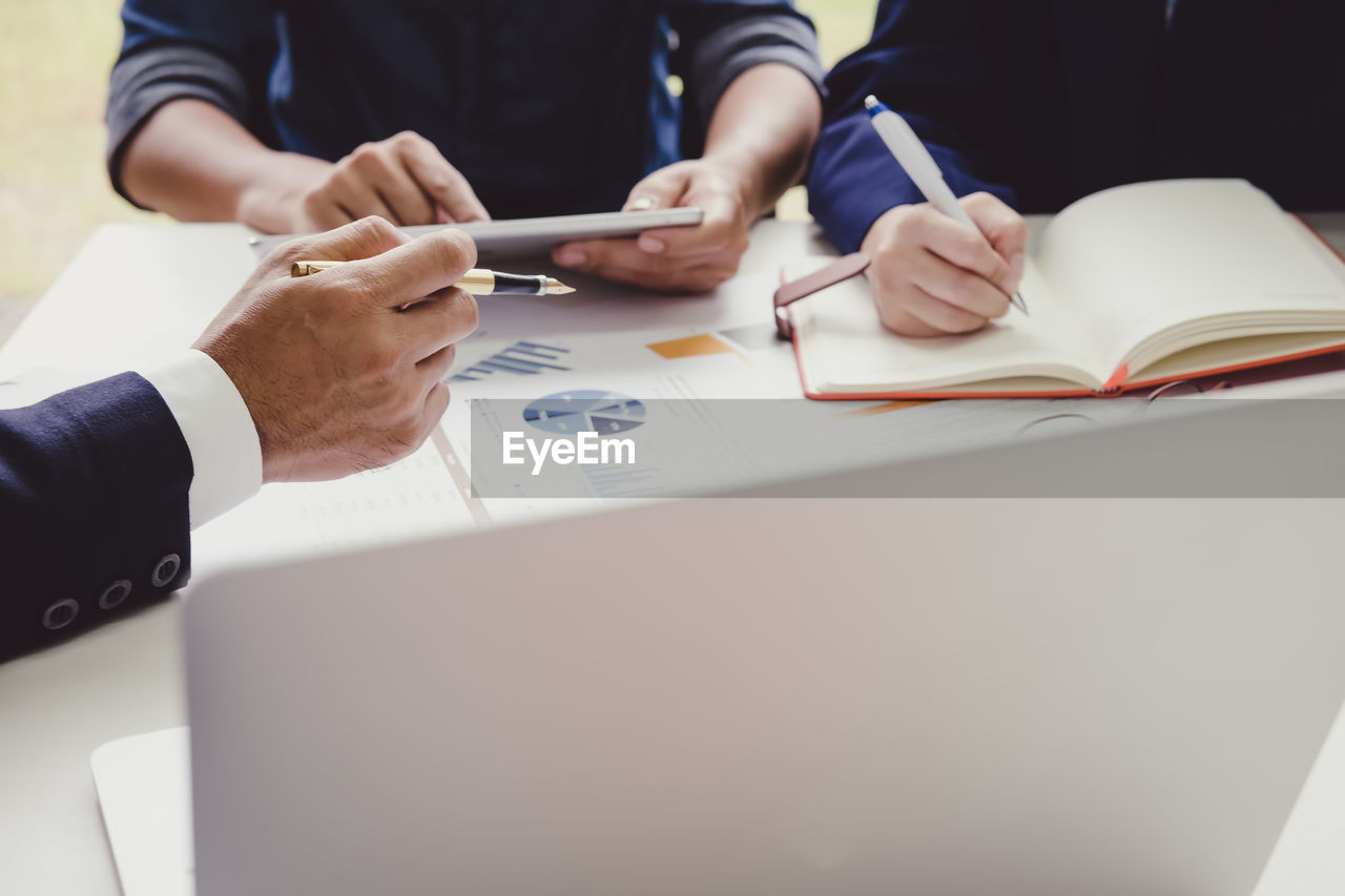 High angle view of business people working at desk