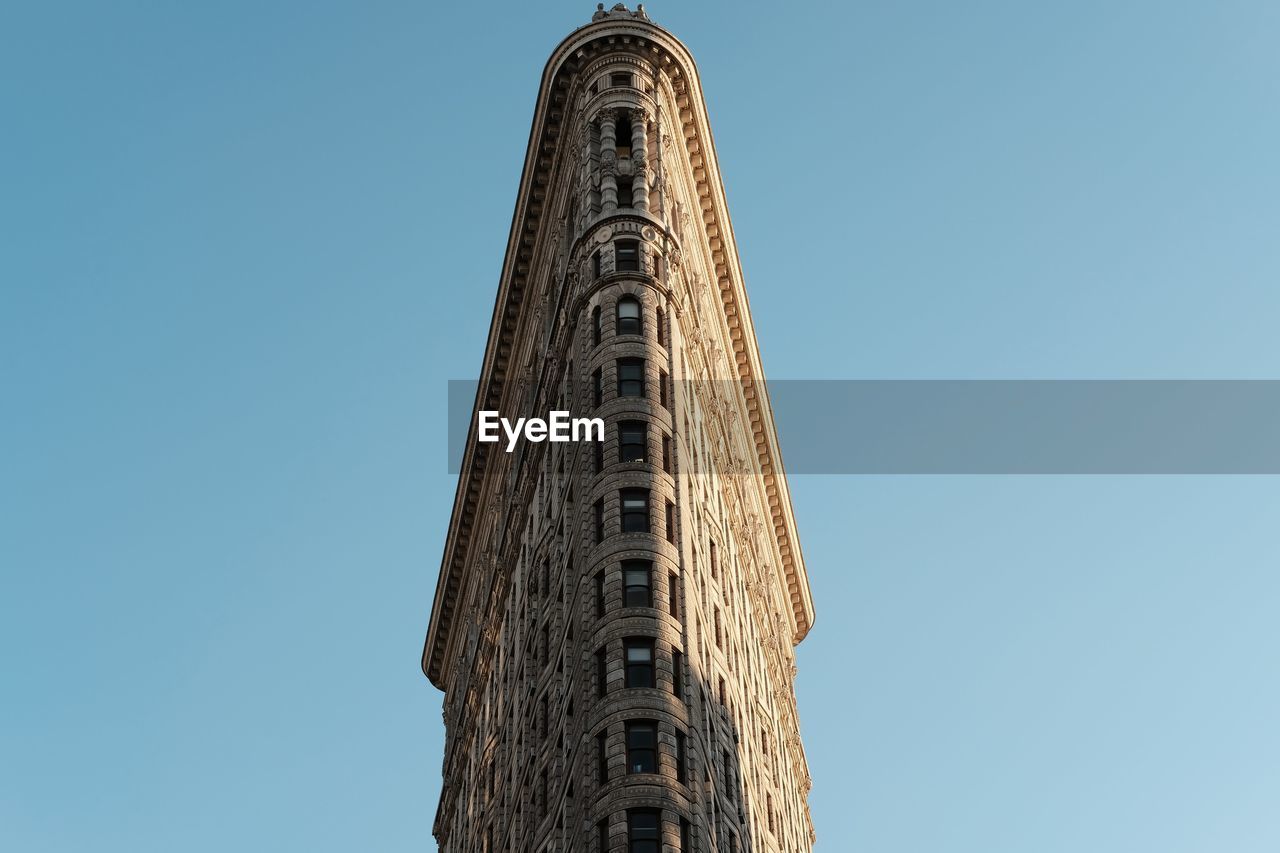 Flat iron building against a clear sky