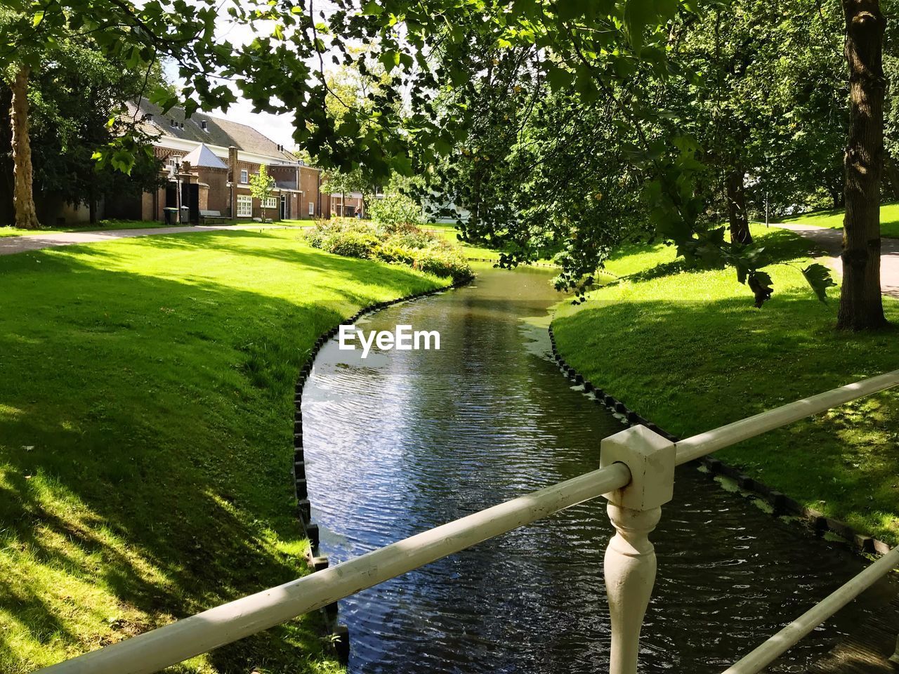 SCENIC VIEW OF LAKE BY BUILDINGS