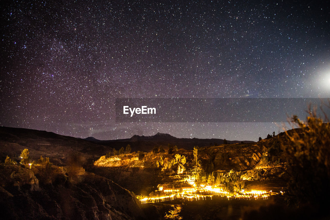 View of starry sky above mountain range