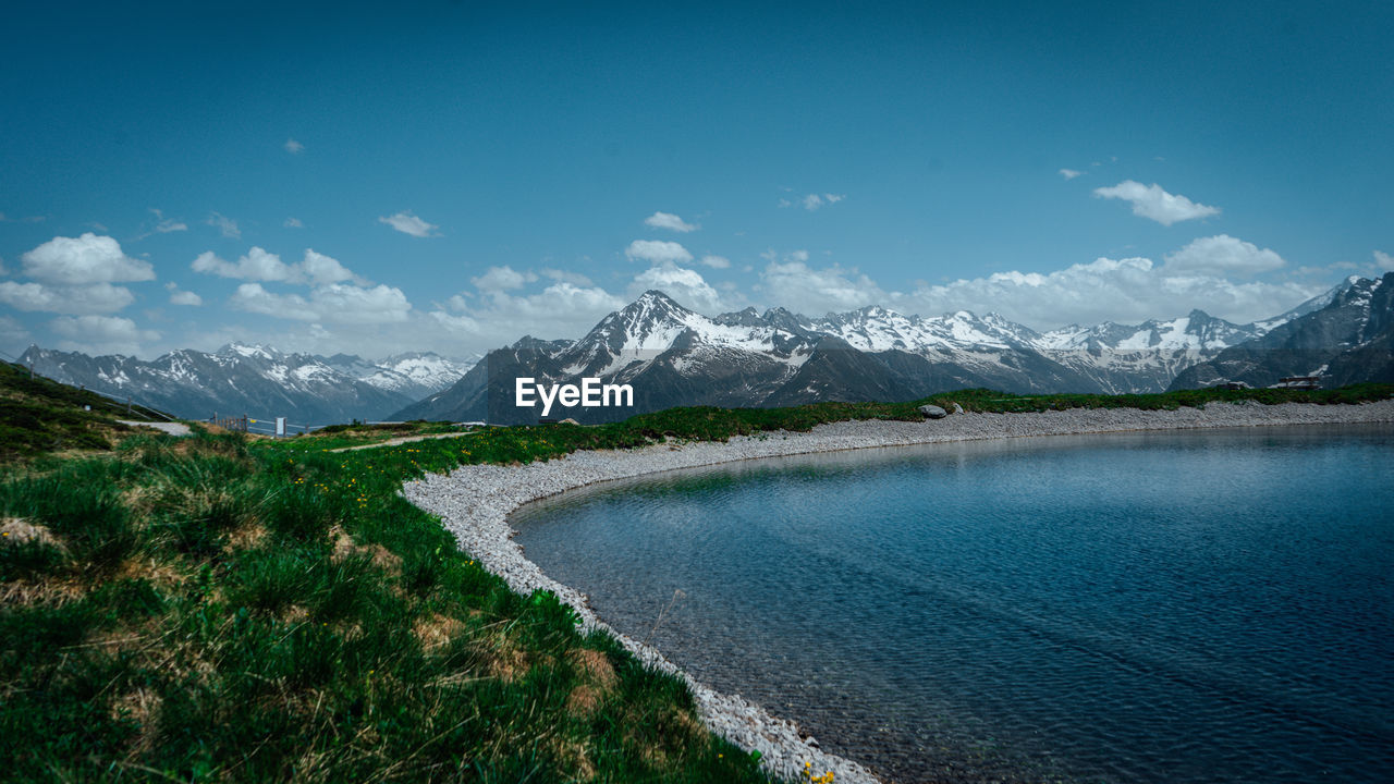 Scenic view of snowcapped mountains against sky