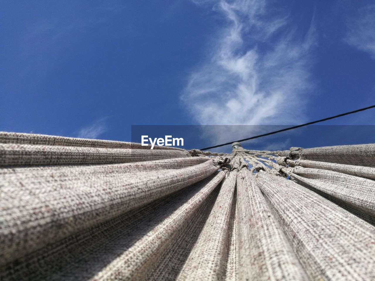 CLOSE-UP LOW ANGLE VIEW OF BLUE SKY AND CLOUDS