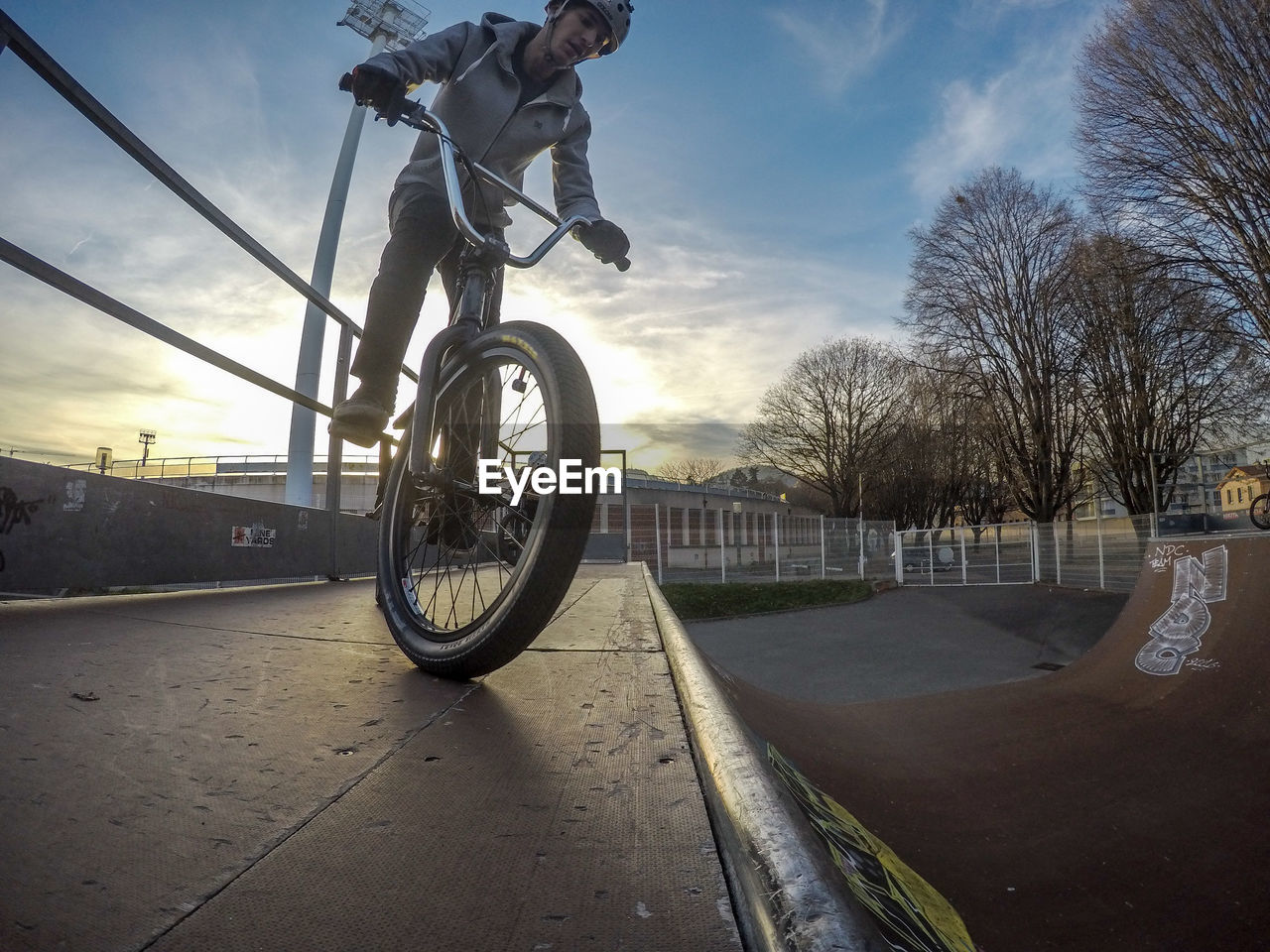 Young man on bicycle in skate park