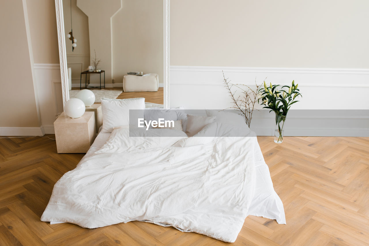 Cozy bright bedroom in warm shades in scandinavian style. home interior