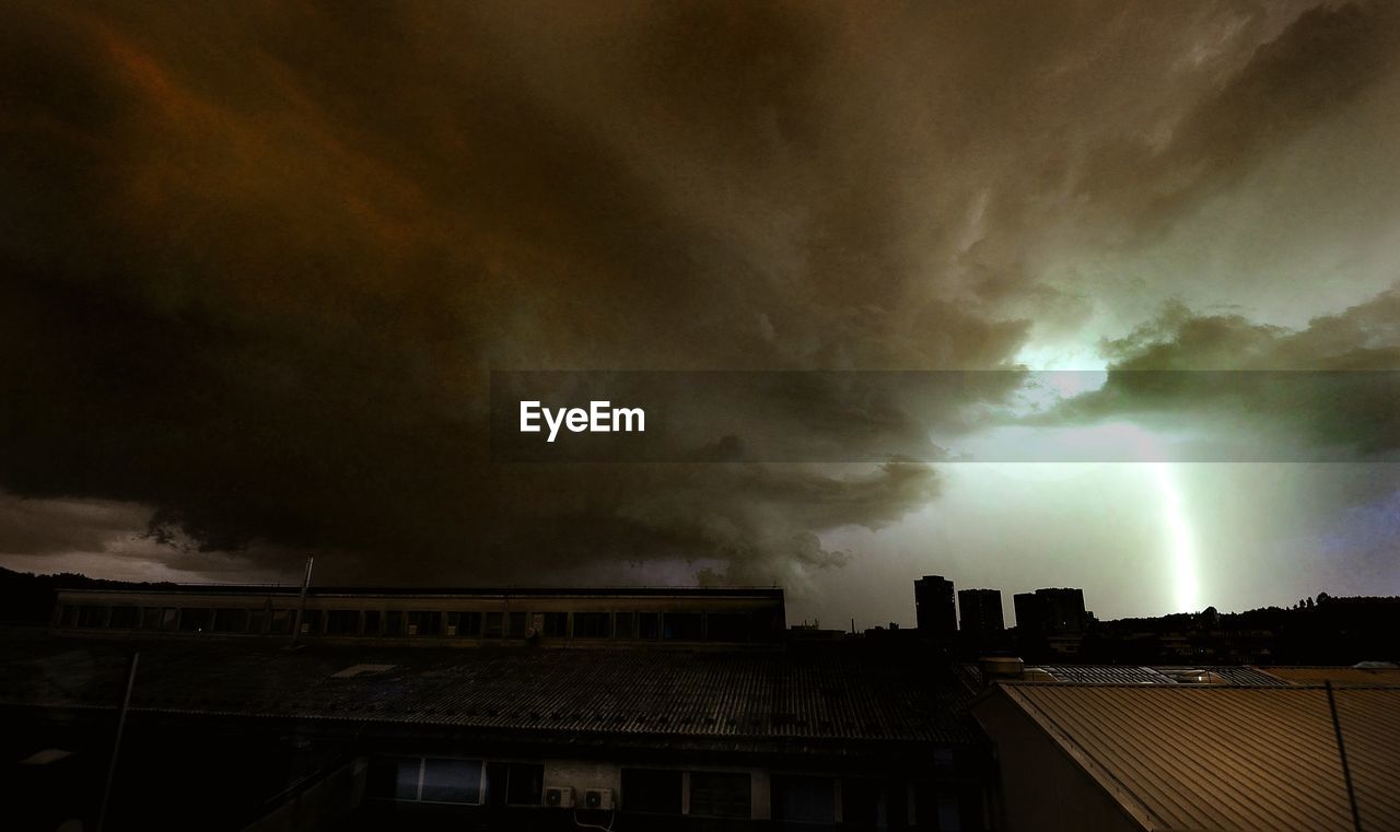 STORM CLOUDS OVER BUILDINGS