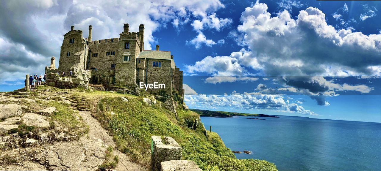 PANORAMIC VIEW OF HISTORIC BUILDING BY SEA