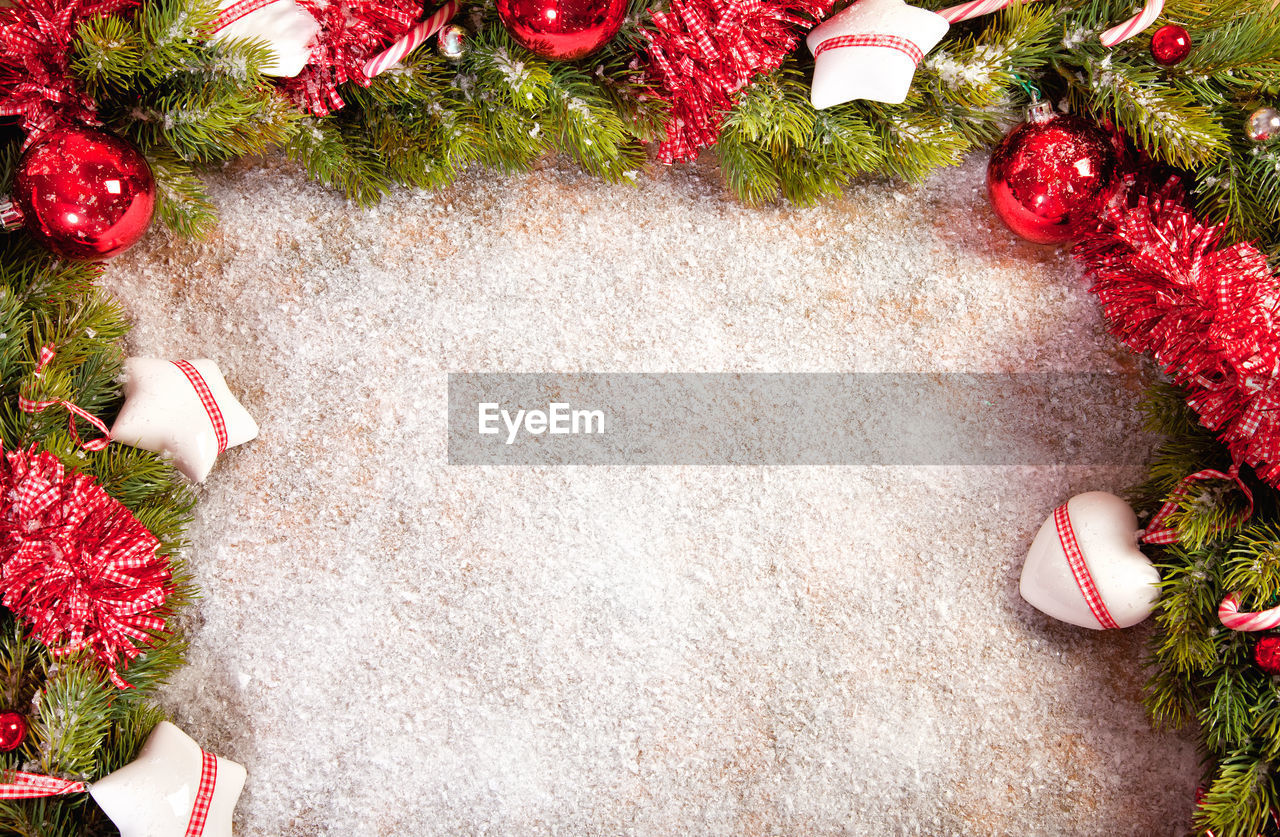 High angle view of snow amidst christmas ornaments