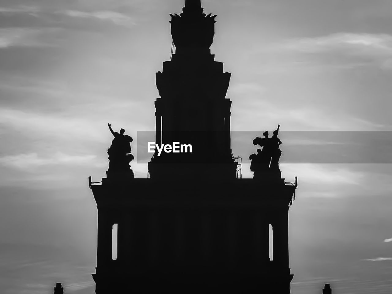 Low angle view of statue against cloudy sky