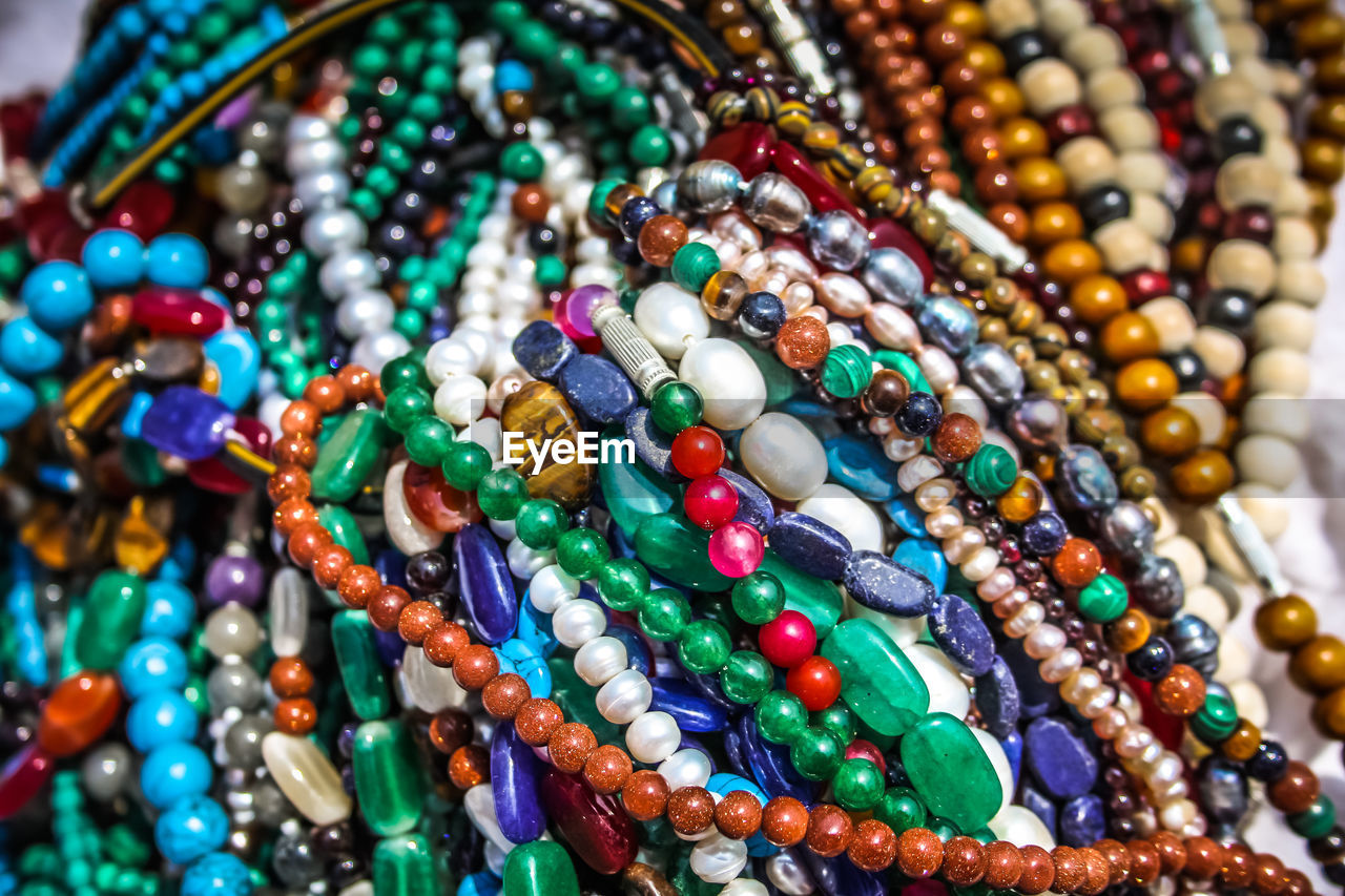 Close-up of multi colored jewelry for sale