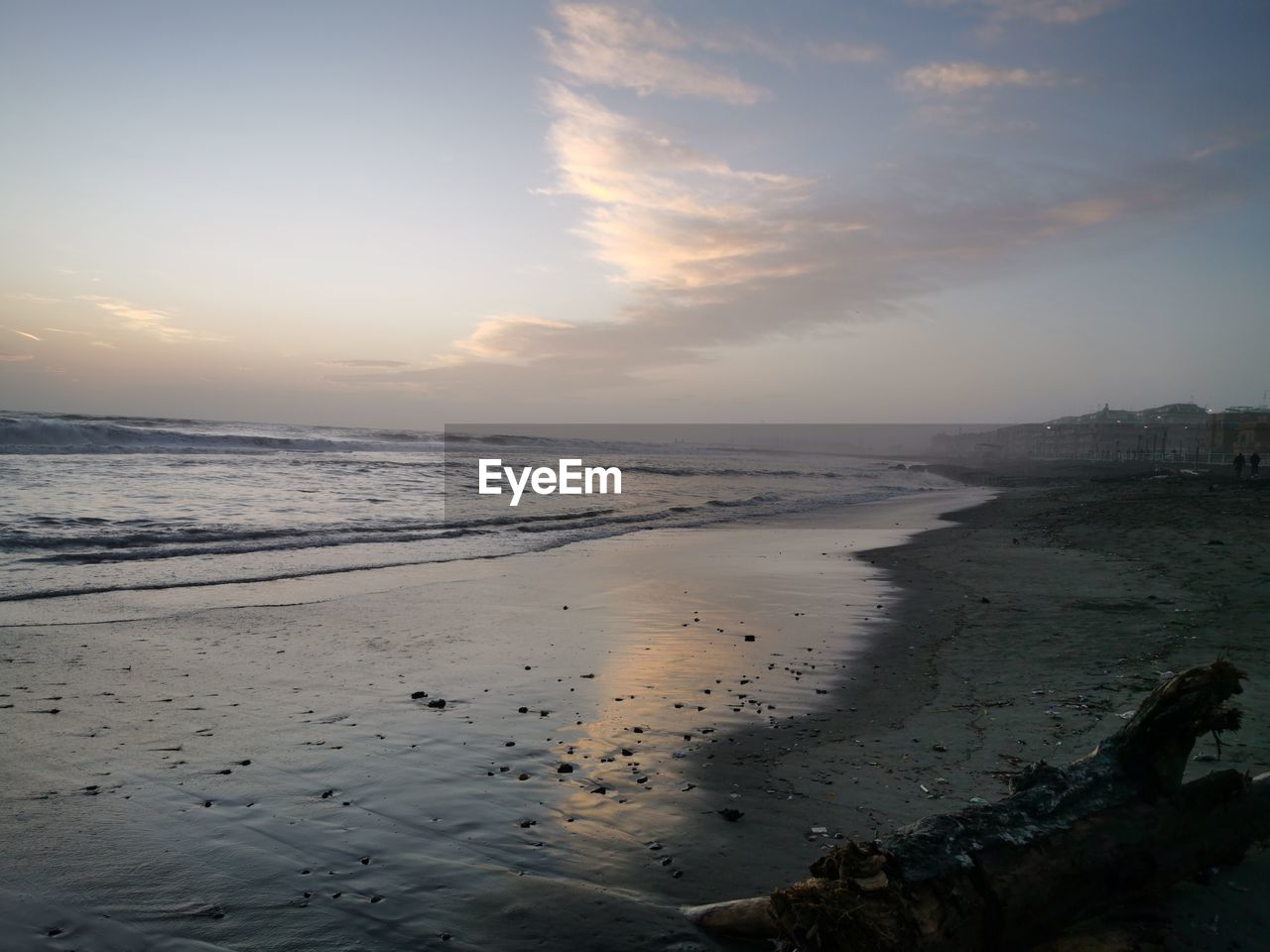 SCENIC VIEW OF BEACH DURING SUNSET