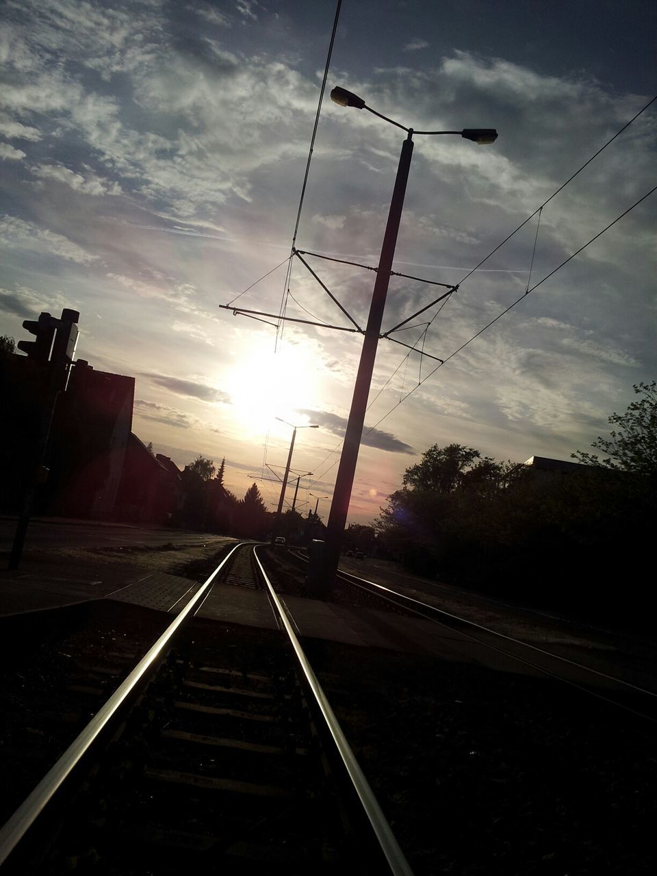 View of railroad track at sunset
