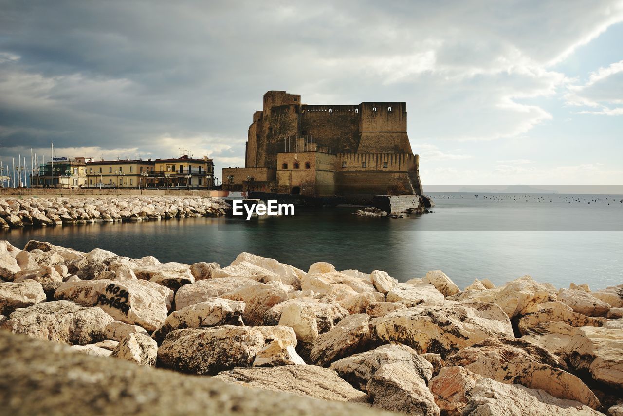 Scenic view of sea against cloudy sky