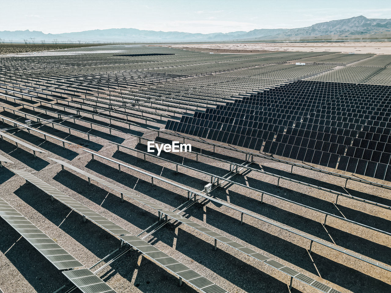 Renewable solar energy solar farm in the desert of southern nevada on a dry lake bed.