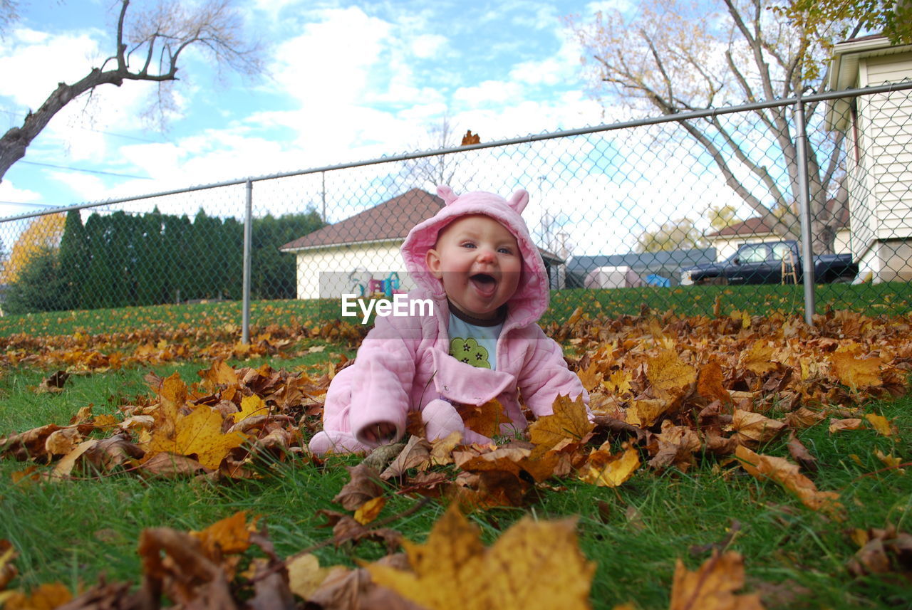 Little girl loving leaves