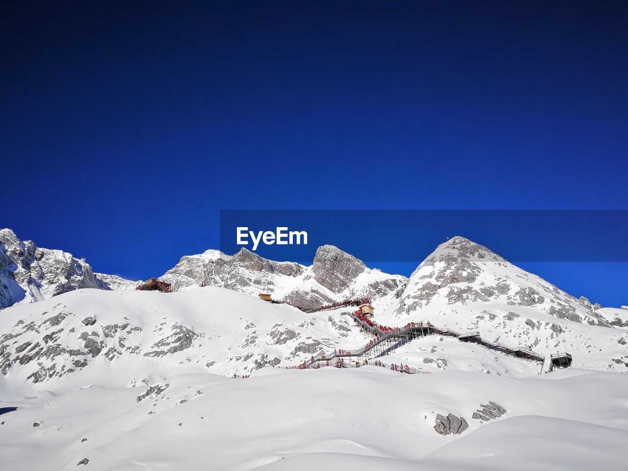 Scenic view of snowcapped mountains against clear blue sky
jade dragon snow mountain