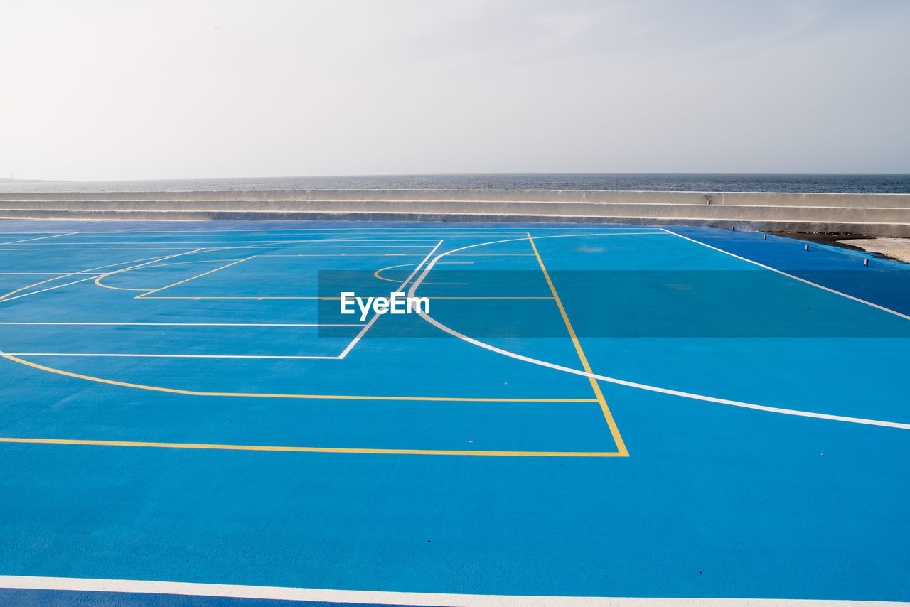 Scenic view of sport field against clear sky