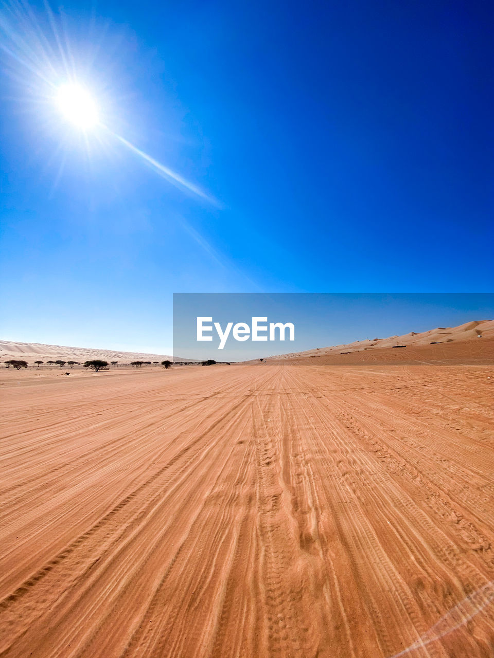 SCENIC VIEW OF DESERT AGAINST BRIGHT SUN