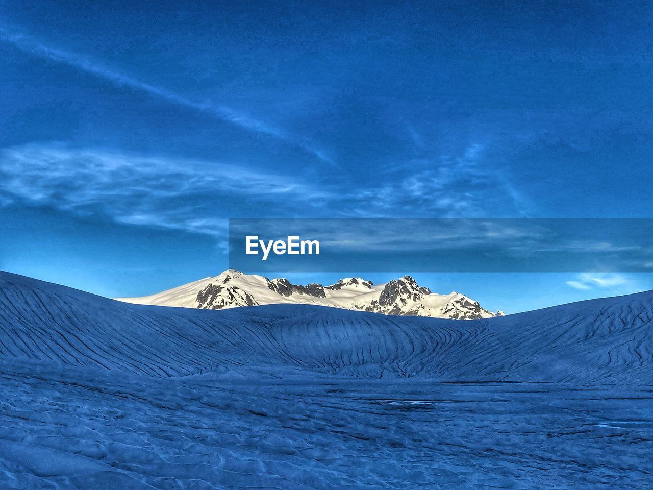 landscape, environment, mountain, snow, scenics - nature, cold temperature, winter, beauty in nature, sky, nature, mountain range, travel destinations, cloud, land, blue, travel, snowcapped mountain, no people, non-urban scene, tranquility, outdoors, plateau, tranquil scene, extreme terrain, frozen, tourism, geology, physical geography