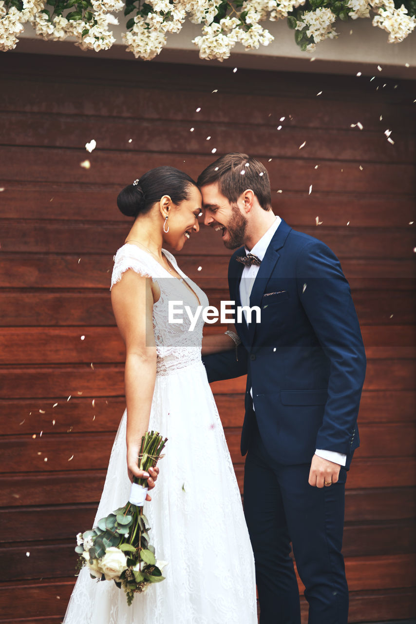 An interracial couple on their wedding day. a happy young man and woman in love getting married