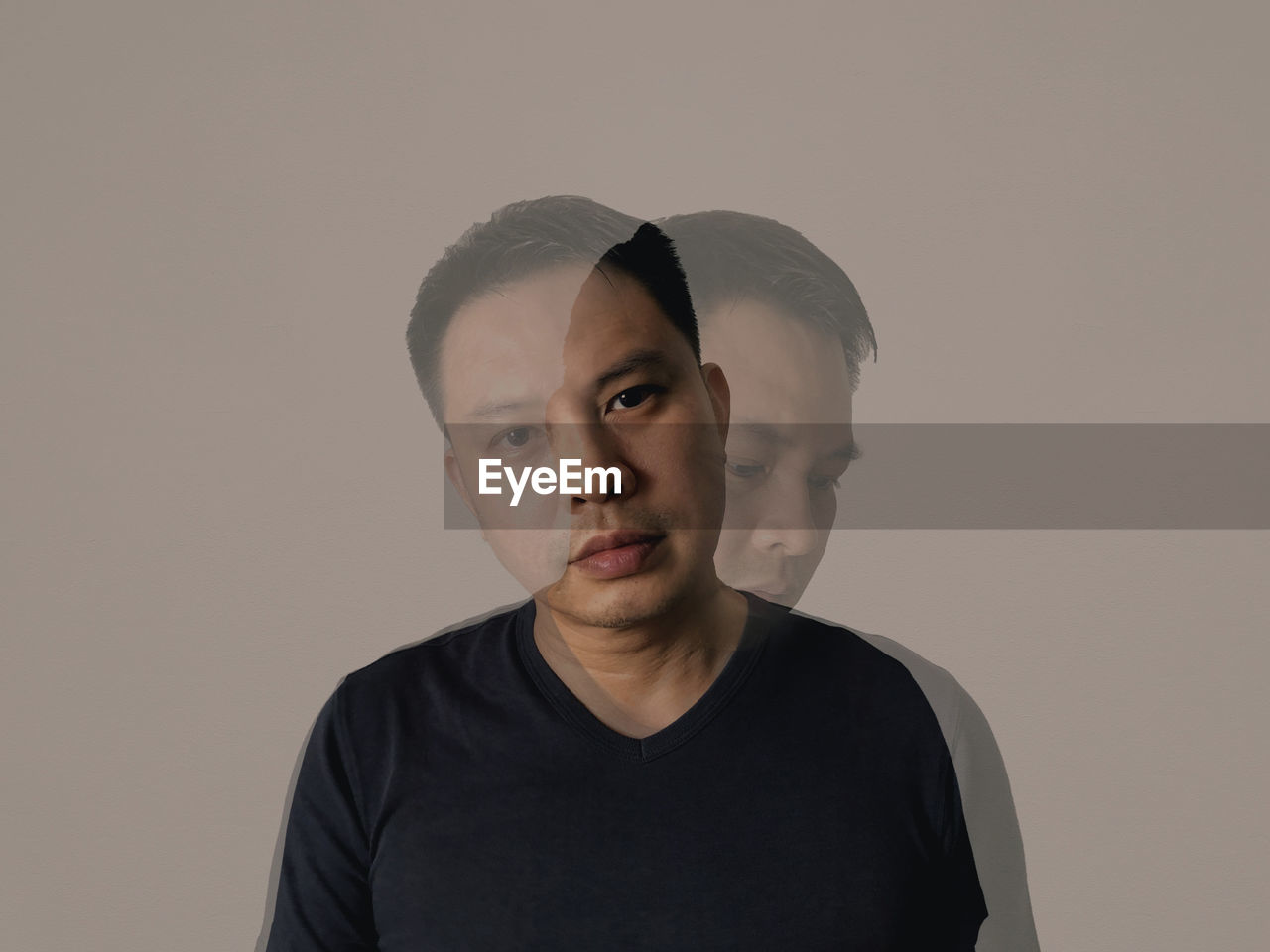 Portrait of young man against white background