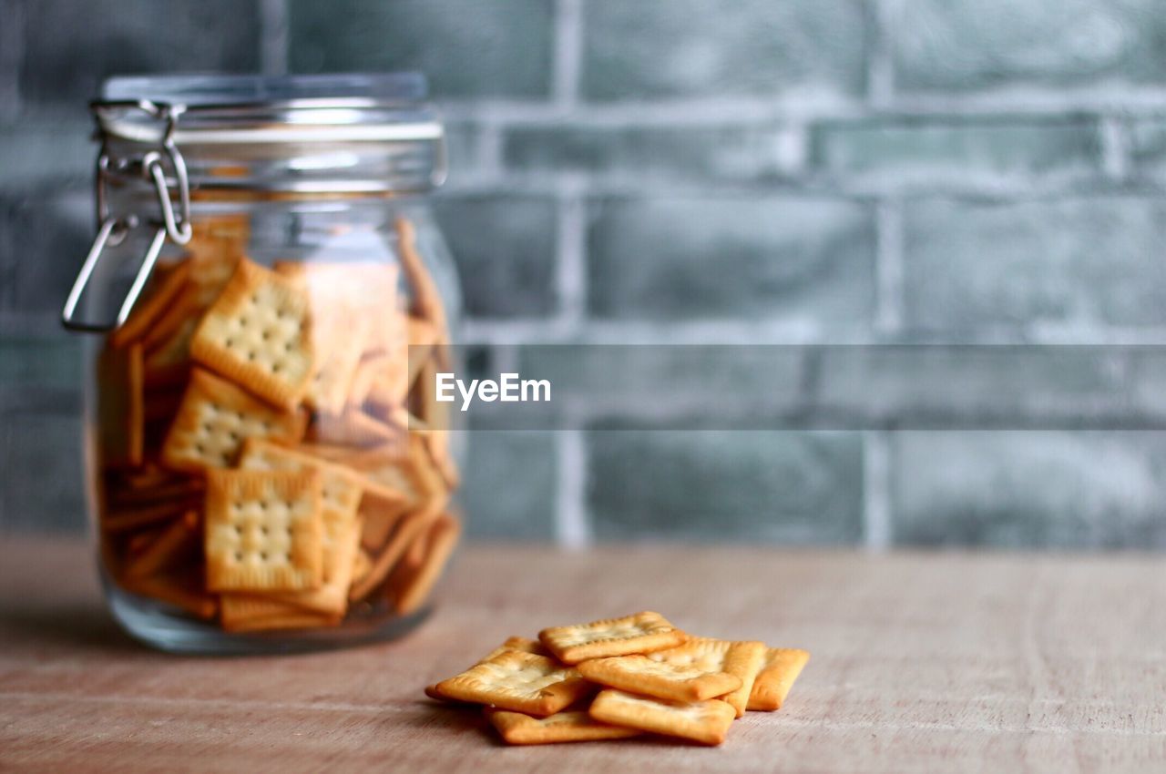 Close-up of cookies in jar on table at home