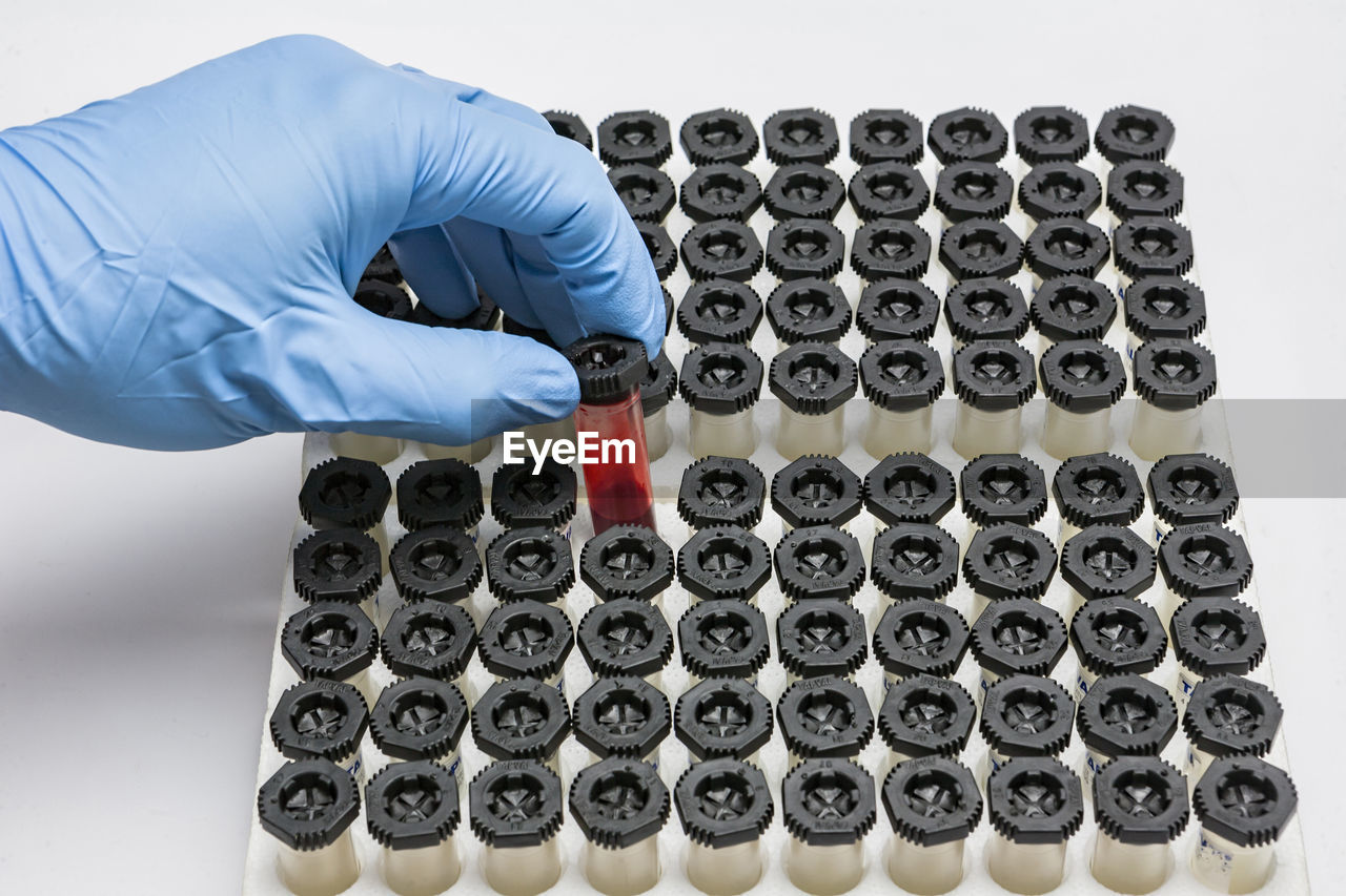 Cropped hand of scientist experimenting in laboratory