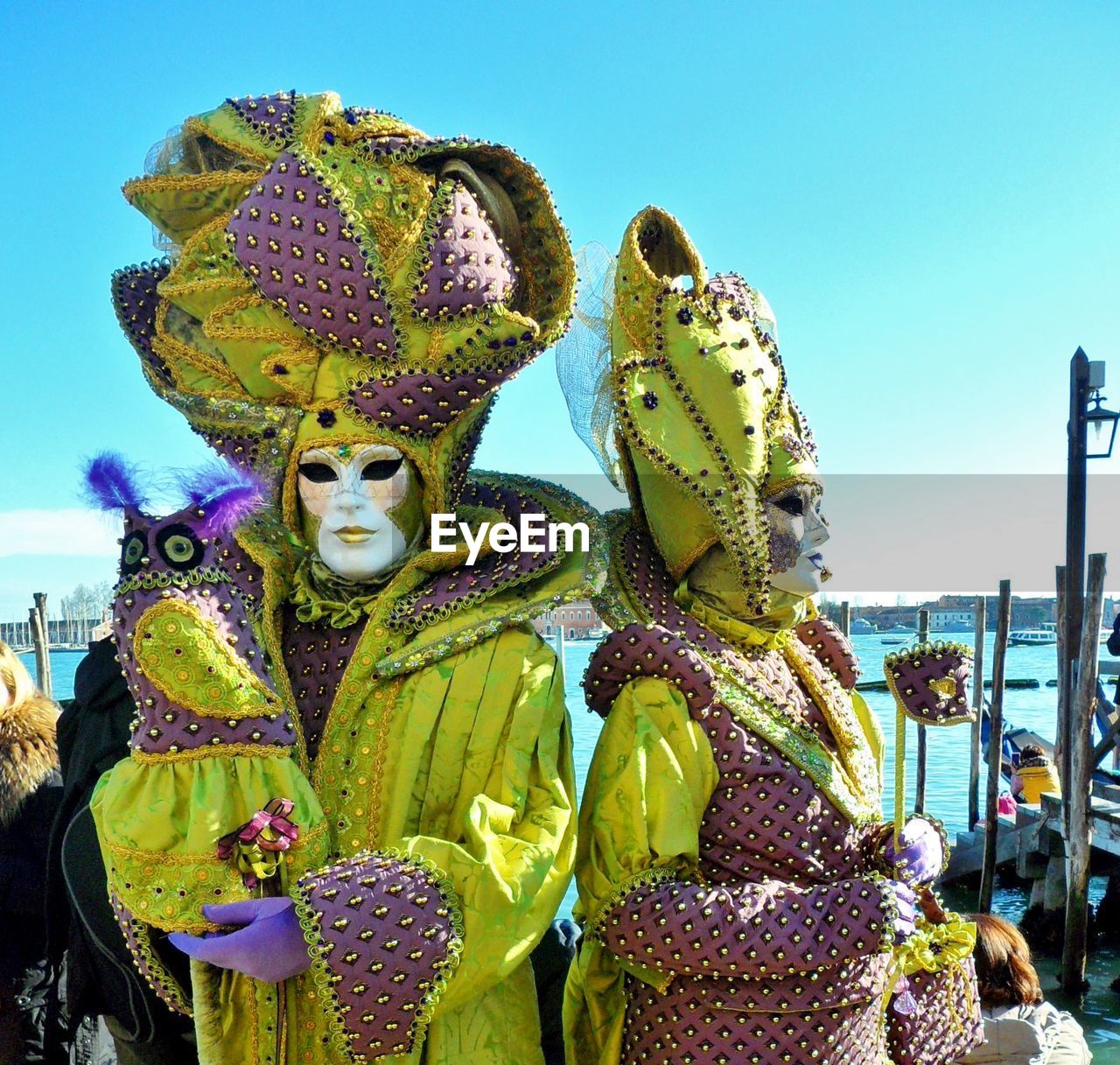 People wearing venetian mask at carnival