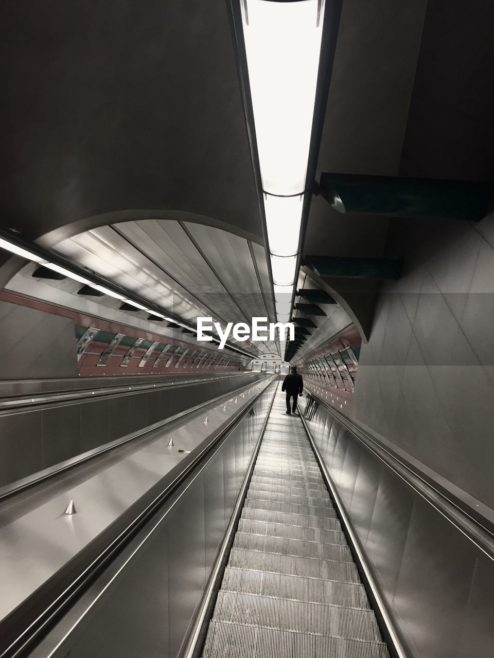 Man on escalator