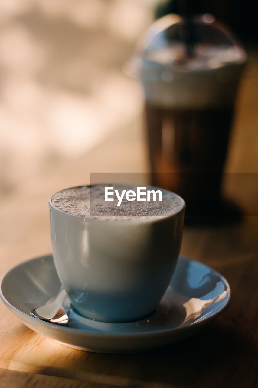 Close-up of coffee cup on table