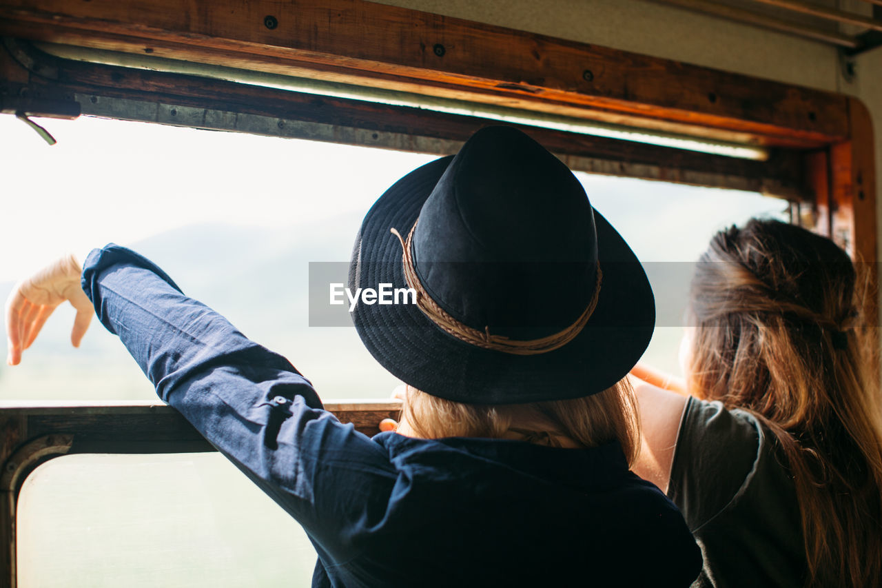 Rear view of couple in train