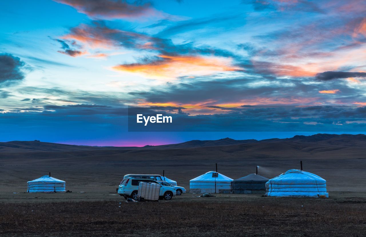 Scenic view of desert against sky during sunset