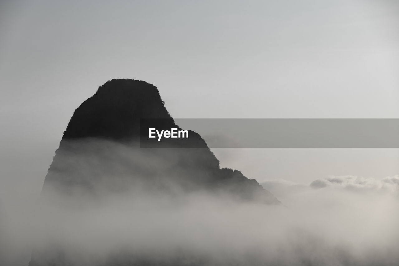 Low angle view of silhouette mountain against sky