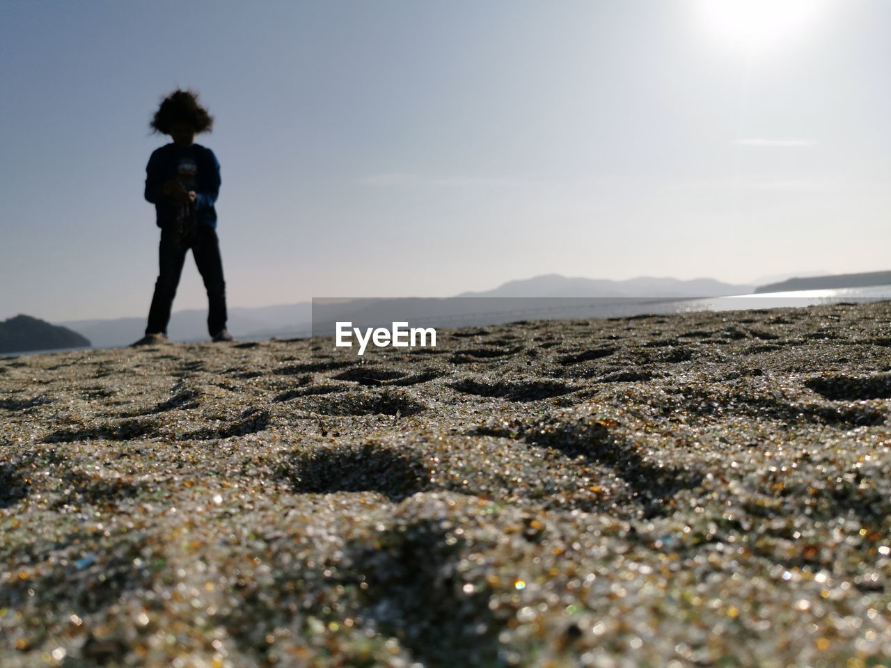 FULL LENGTH OF MAN STANDING ON LAND