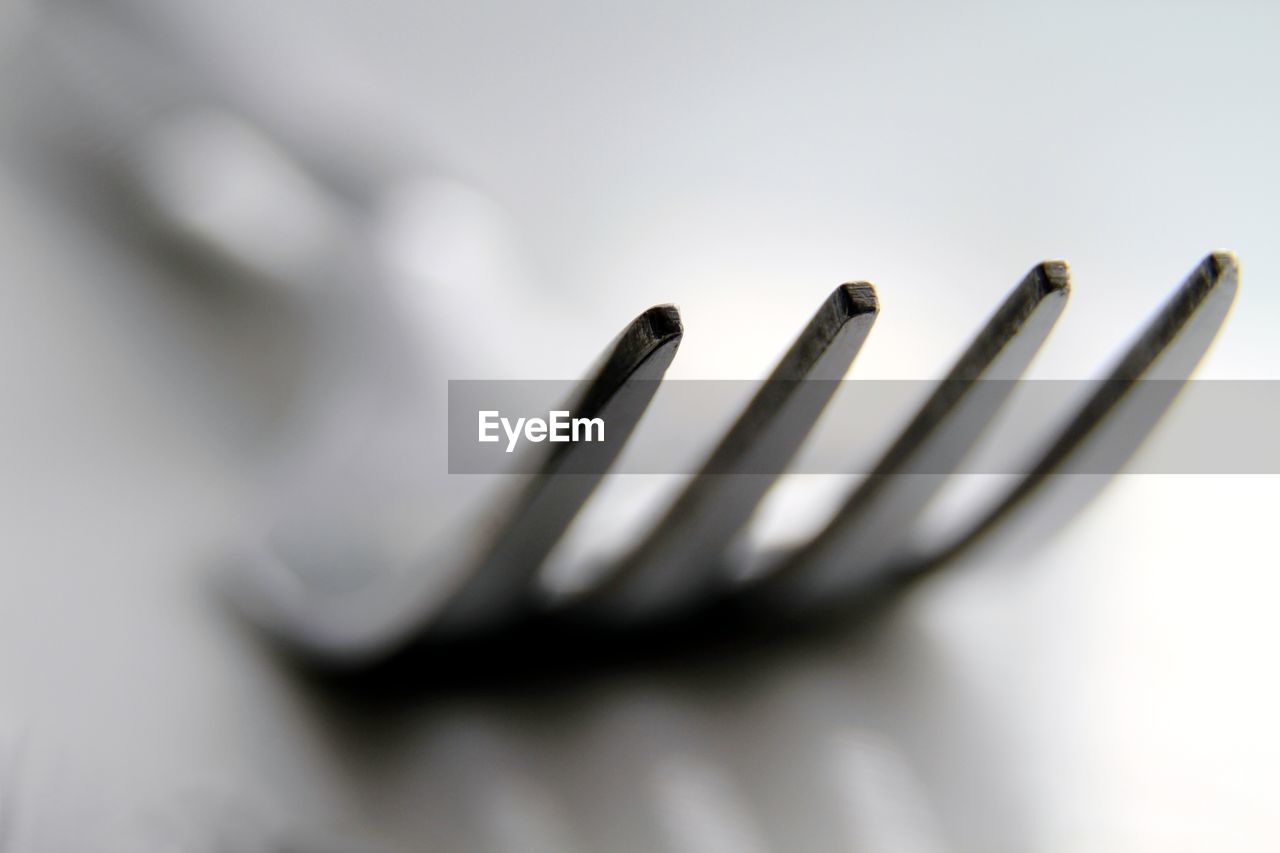 HIGH ANGLE VIEW OF FORK ON TABLE